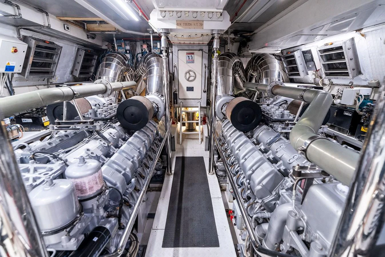 The engine room showcases powerful machinery and a meticulously organized layout. aboard INCOGNITO Yacht for Sale