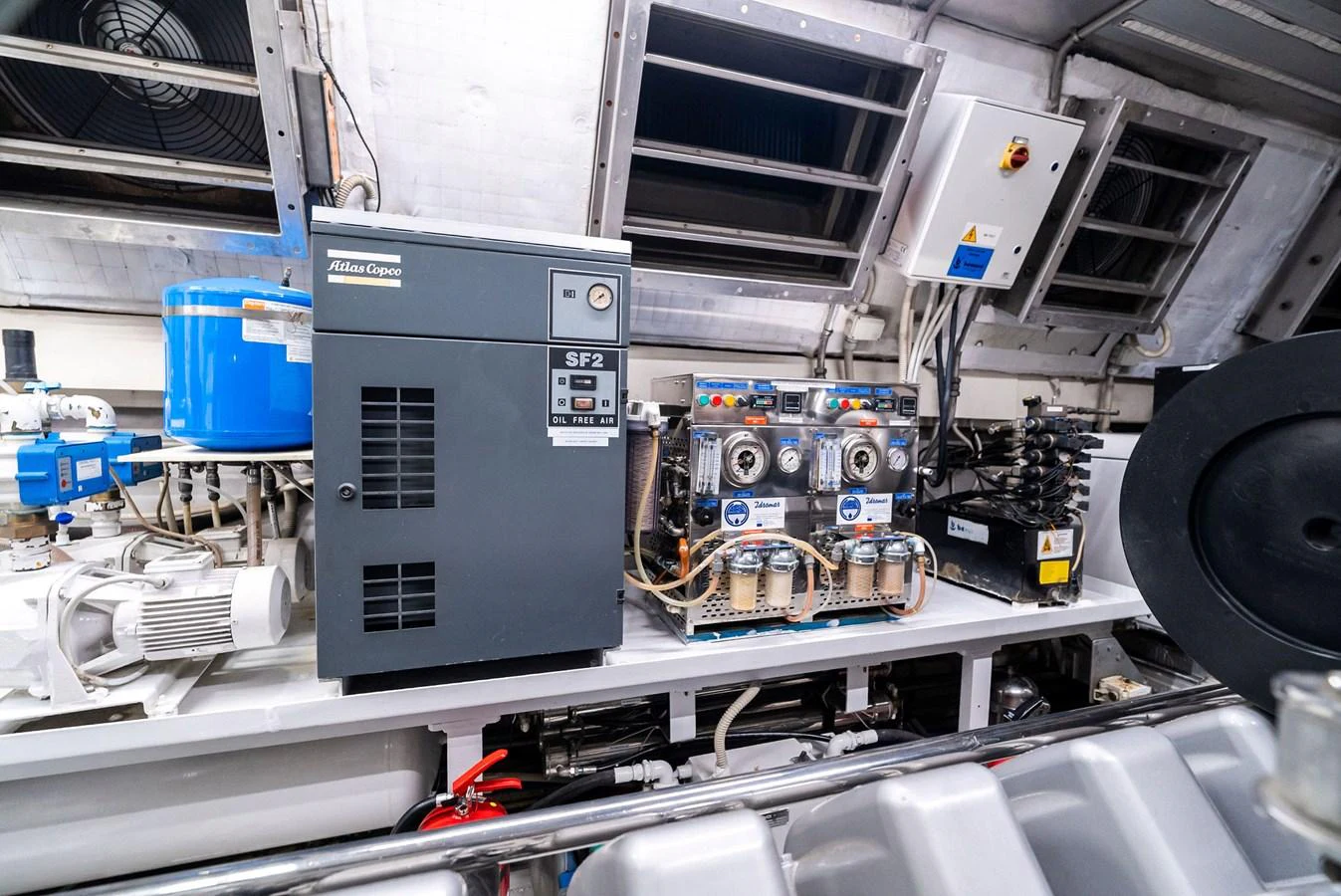 The image showcases the engine room with various technical equipment and machinery. aboard INCOGNITO Yacht for Sale