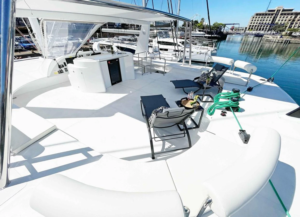 The flybridge offers a spacious and inviting area for relaxation and entertainment with comfortable seating and a well-equipped bar. aboard SILHOUETTE 800 Yacht for Sale
