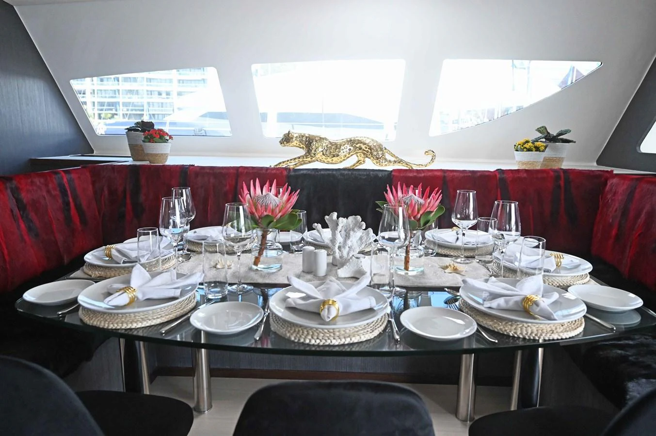 The yacht's dining area features an elegant table setting with a luxurious ambiance. aboard SILHOUETTE 800 Yacht for Sale