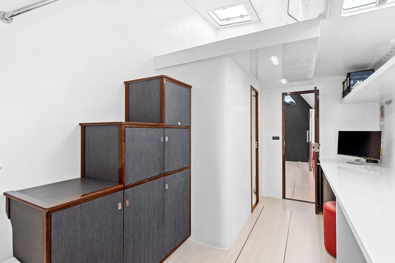 The yacht's interior features a sleek, modern design with ample storage and workspace. aboard SILHOUETTE 800 Yacht for Sale