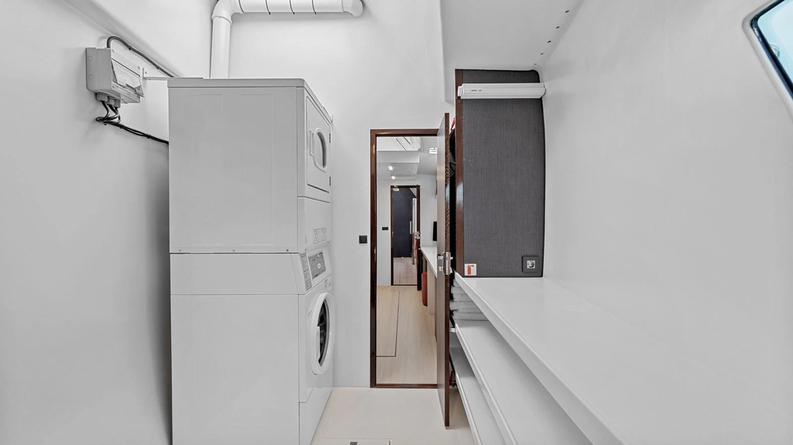 The yacht features a well-equipped laundry room with modern appliances and ample storage space. aboard SILHOUETTE 800 Yacht for Sale