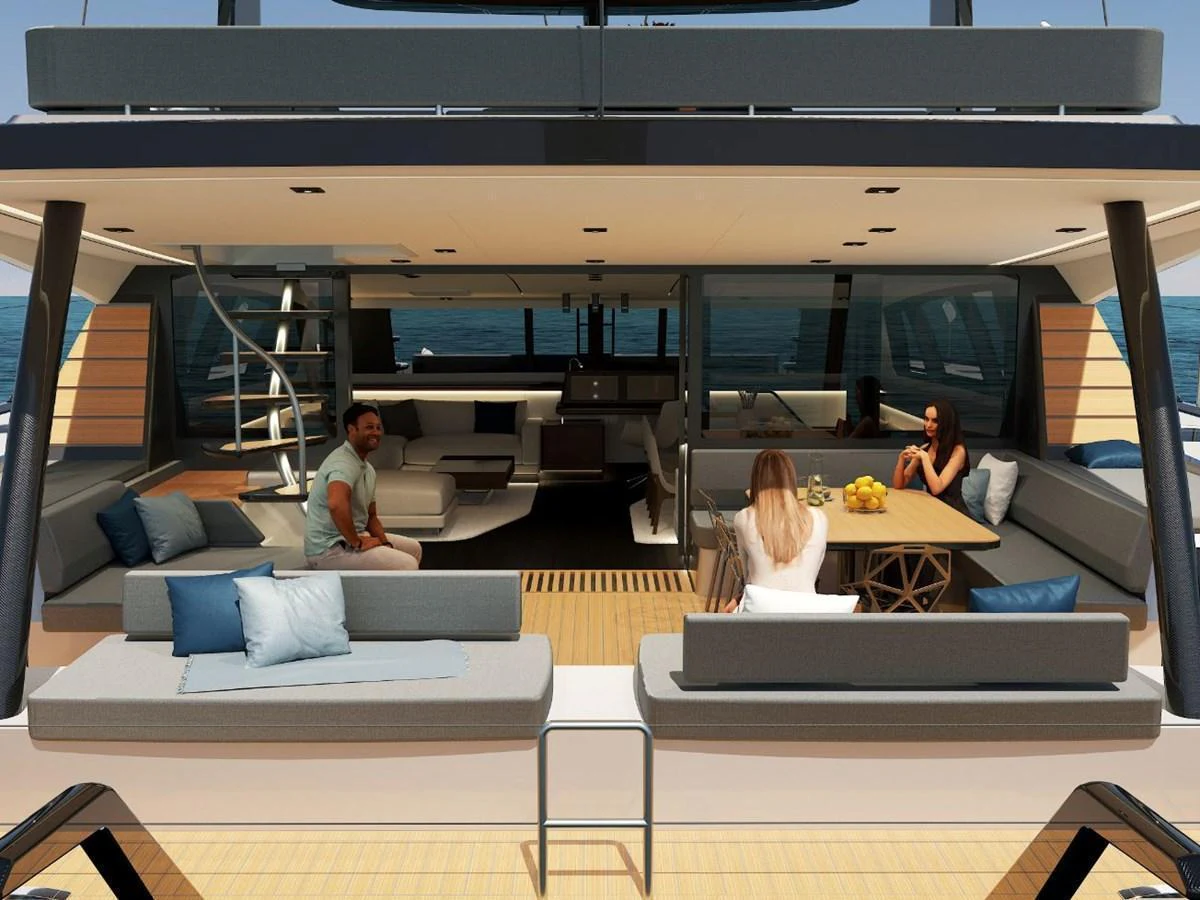 The aft deck features a spacious seating area with a dining table, perfect for social gatherings. aboard AIR YACHT Yacht for Sale