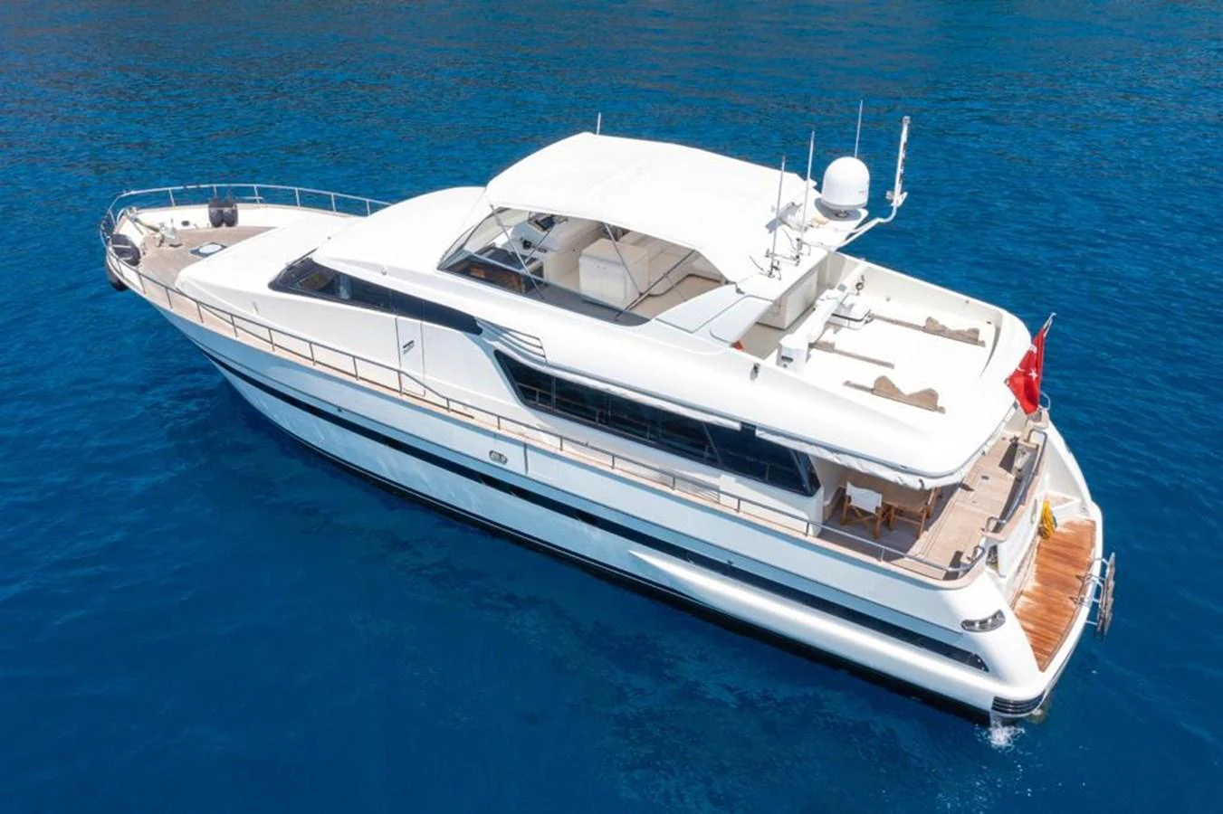 A sleek and modern yacht cruising on clear blue waters. aboard BARBAROSSA MORATTI Yacht for Sale