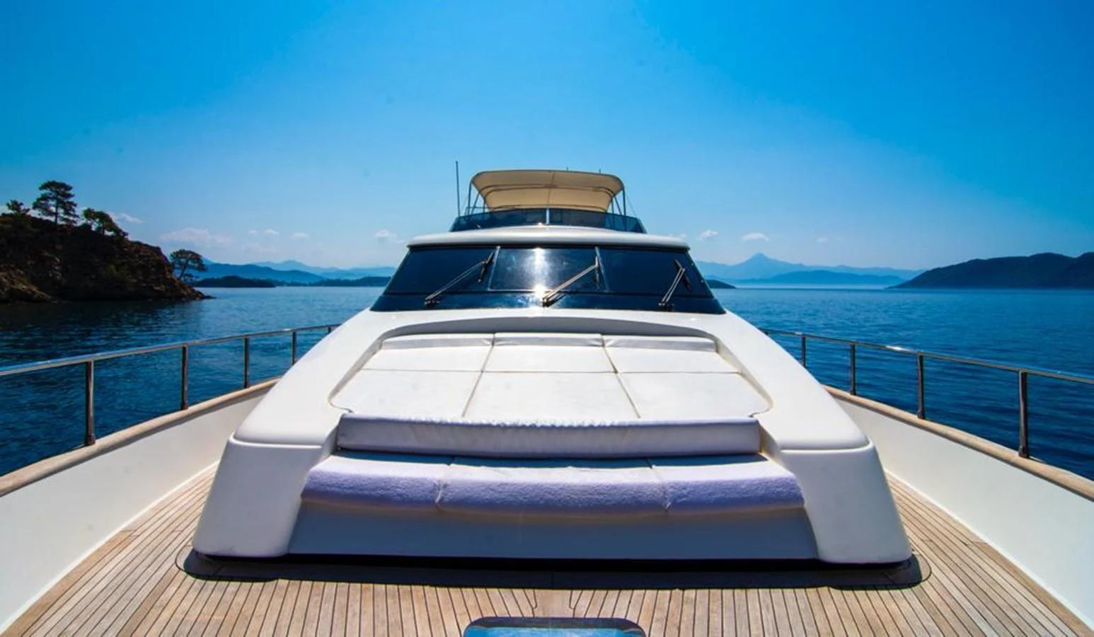 The foredeck of the yacht features a spacious sunbathing area with stunning views of the surrounding waters. aboard BARBAROSSA MORATTI Yacht for Sale