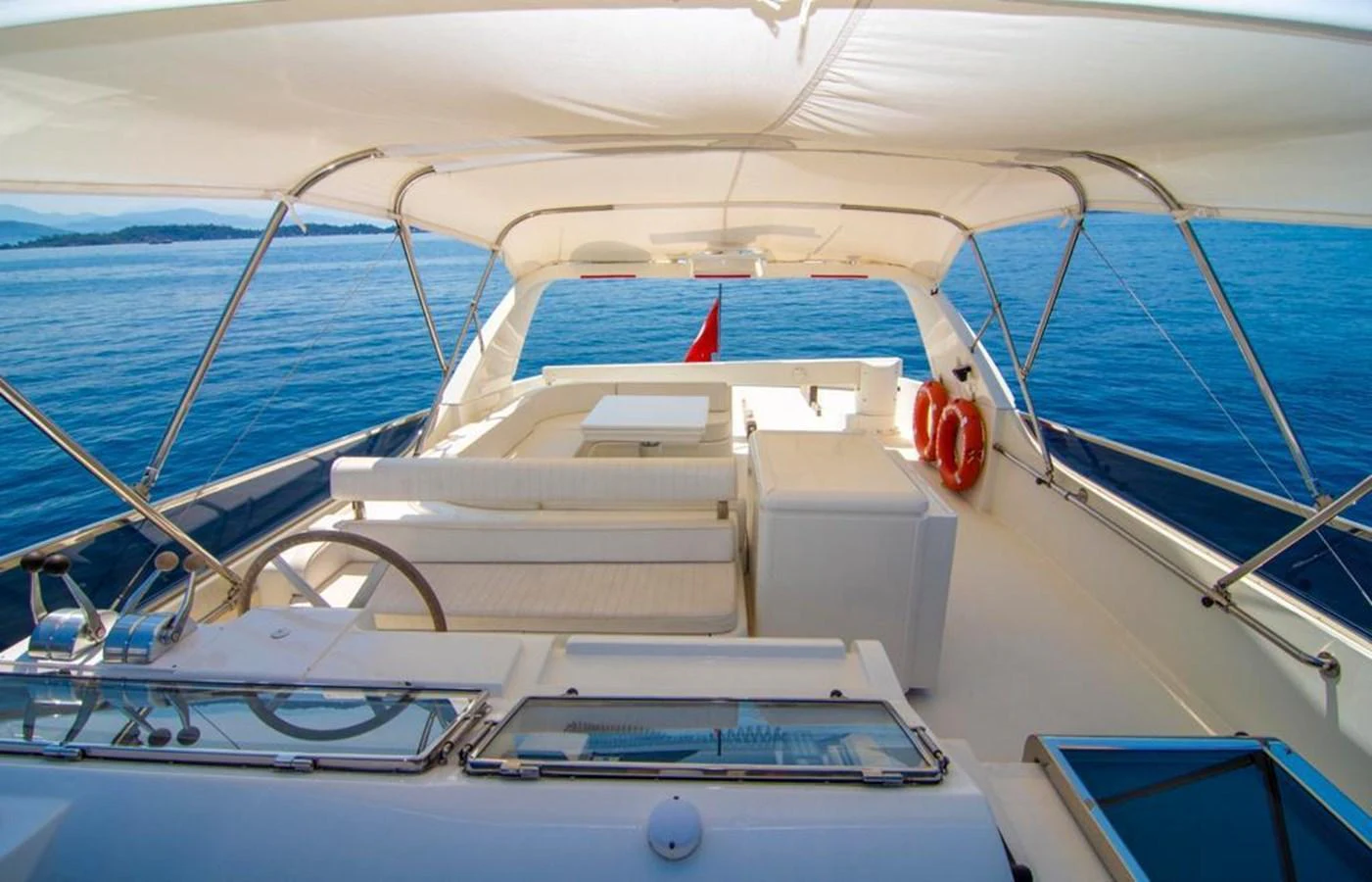 The flybridge offers a spacious and shaded area with comfortable seating and stunning ocean views. aboard BARBAROSSA MORATTI Yacht for Sale