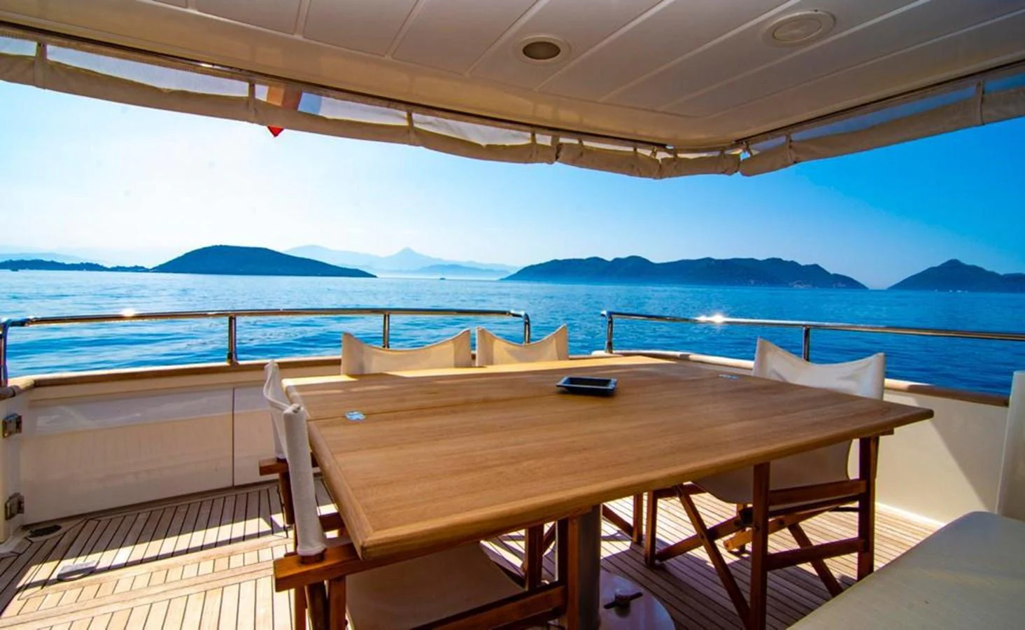The aft deck features a spacious dining area with stunning ocean views. aboard BARBAROSSA MORATTI Yacht for Sale