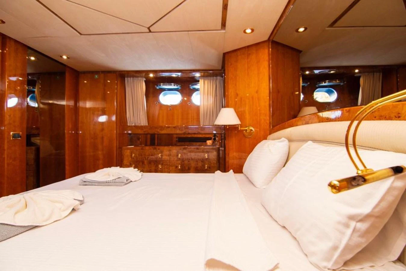 The stateroom features luxurious wood paneling and plush bedding, creating a warm and inviting atmosphere. aboard BARBAROSSA MORATTI Yacht for Sale