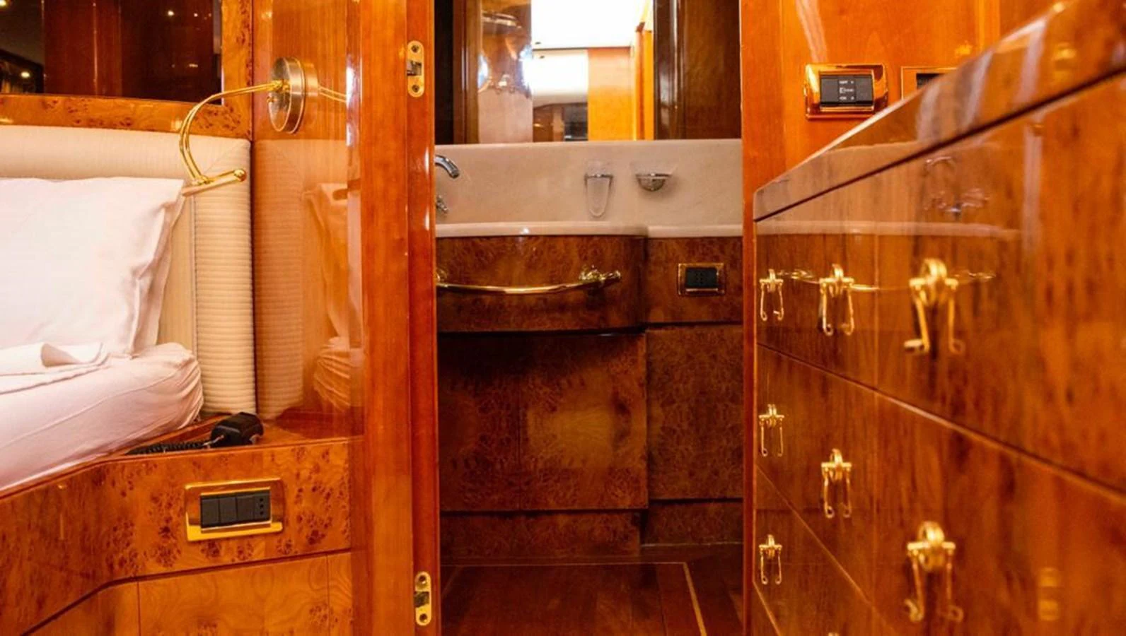 The yacht's interior features luxurious wooden cabinetry and elegant fixtures. aboard BARBAROSSA MORATTI Yacht for Sale