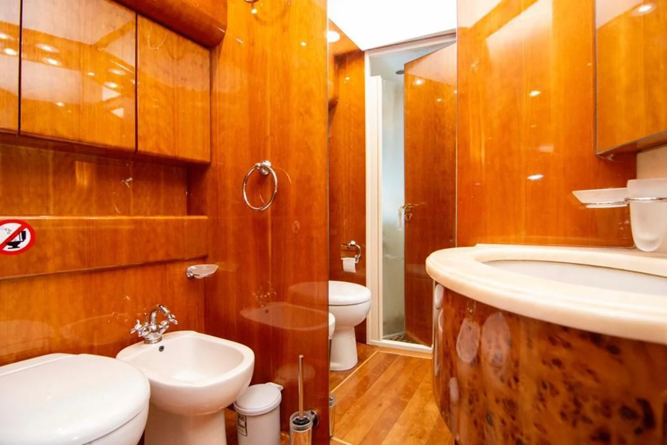 The yacht's bathroom features elegant wooden finishes and modern fixtures. aboard BARBAROSSA MORATTI Yacht for Sale