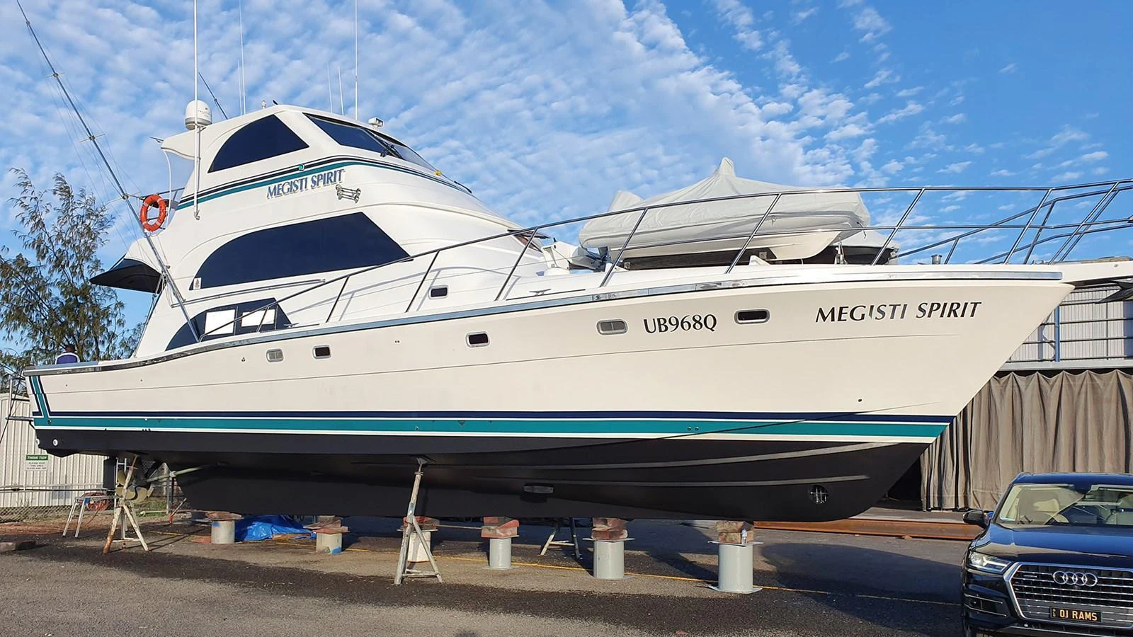 A sleek yacht is displayed on dry land, showcasing its elegant lines and modern design. aboard MEGISTI SPIRIT Yacht for Sale