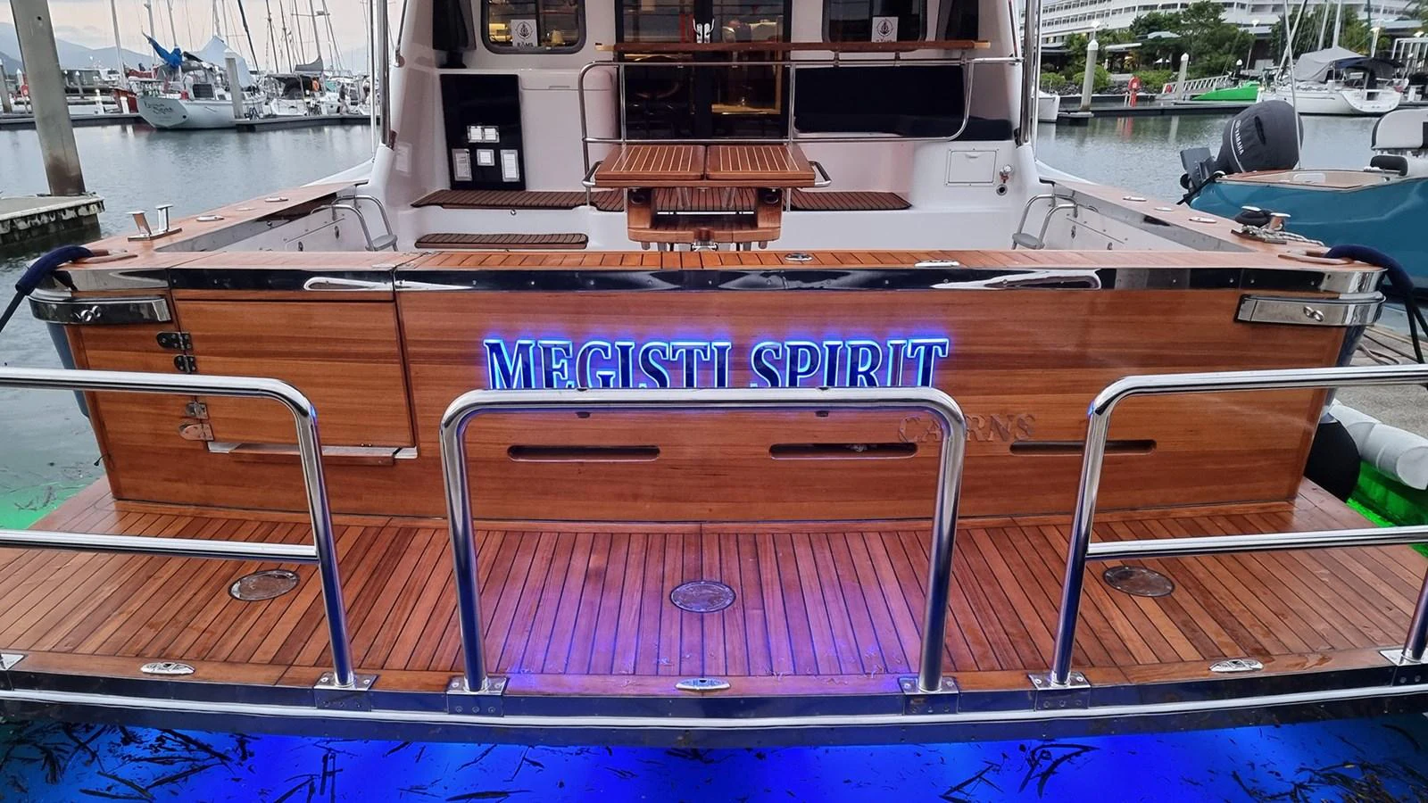 The aft deck features elegant wooden finishes and a welcoming ambiance, perfect for relaxation and socializing. aboard MEGISTI SPIRIT Yacht for Sale