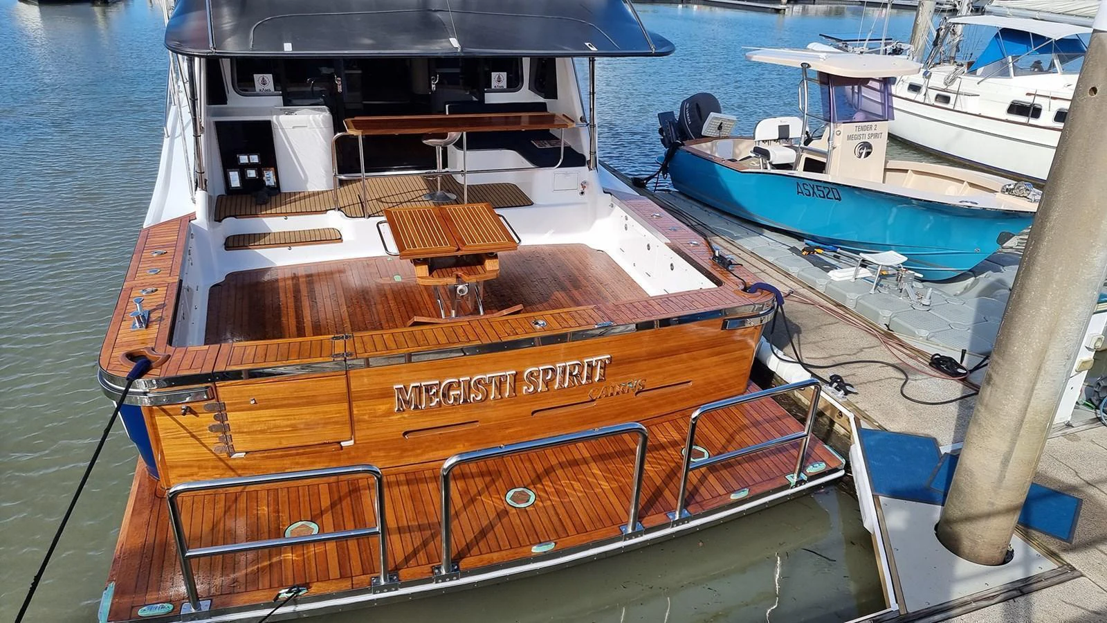 The yacht's aft deck features a spacious and elegant teak layout, perfect for outdoor relaxation and dining. aboard MEGISTI SPIRIT Yacht for Sale