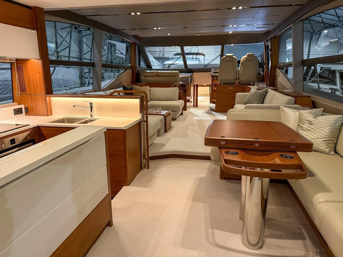 The salon features a spacious and elegant layout with plush seating and modern amenities. aboard PRINCESS 70 Yacht for Sale