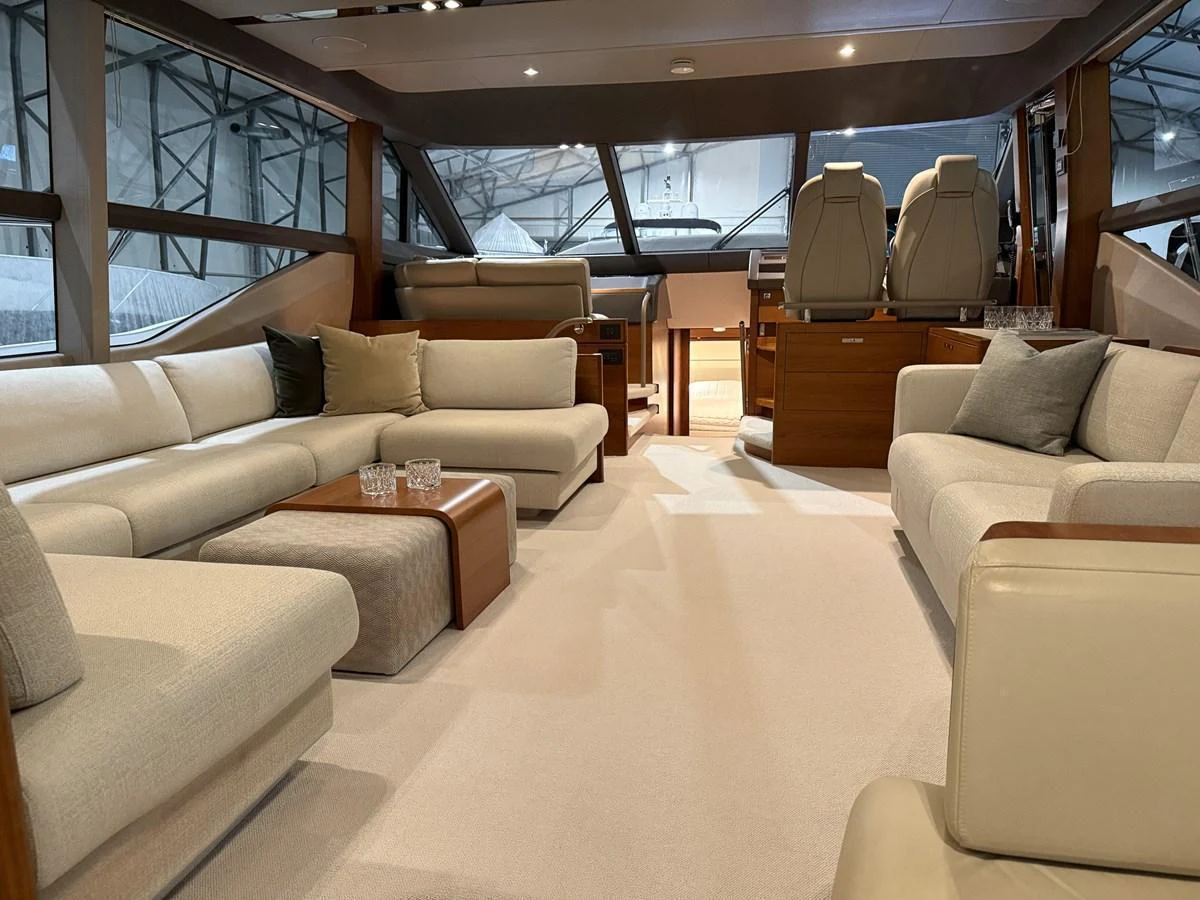 The salon features plush seating and a sophisticated ambiance, perfect for relaxation and socializing. aboard PRINCESS 70 Yacht for Sale