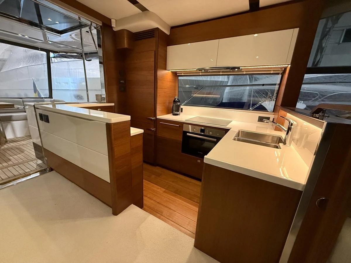 The yacht's galley features modern appliances and sleek cabinetry, offering a stylish and functional space for meal preparation. aboard PRINCESS 70 Yacht for Sale
