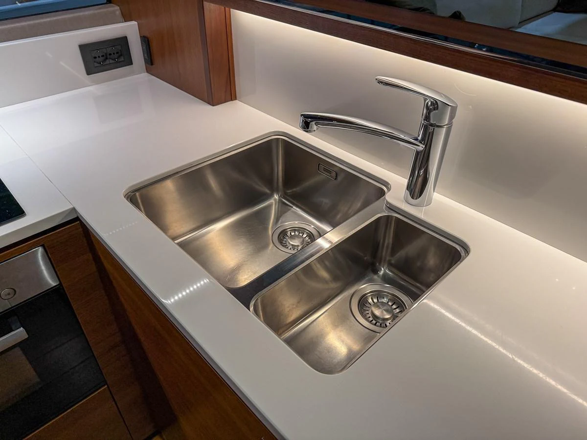 A sleek and modern stainless steel double sink in the yacht's galley. aboard PRINCESS 70 Yacht for Sale