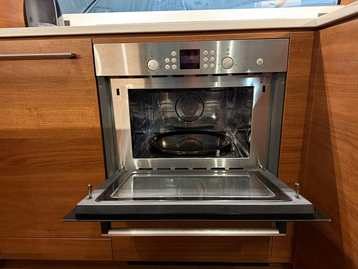 A modern stainless steel oven is integrated into the yacht's galley cabinetry. aboard PRINCESS 70 Yacht for Sale