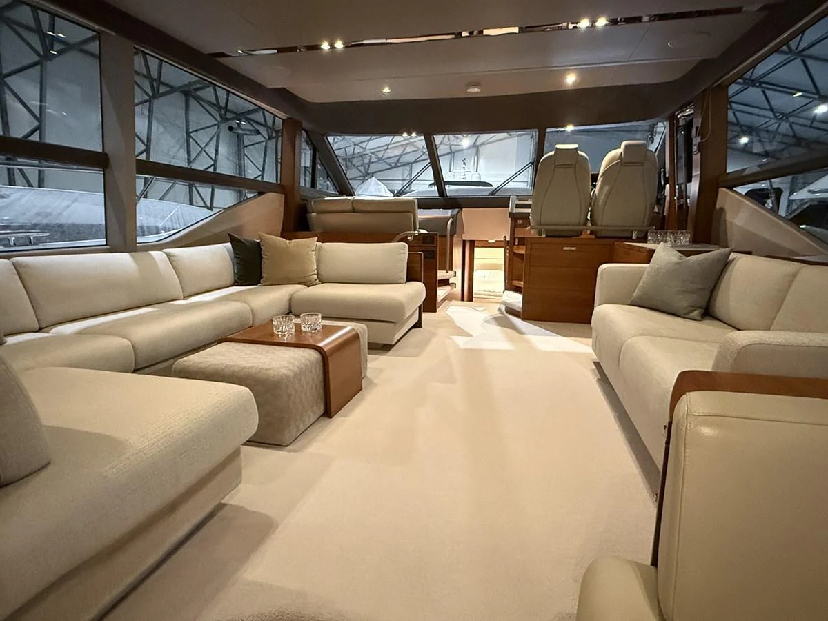 The salon features plush seating and a refined ambiance, perfect for relaxation and socializing. aboard PRINCESS 70 Yacht for Sale