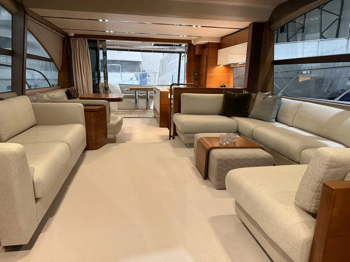 The yacht's salon features plush seating and a modern, open layout with ample natural light. aboard PRINCESS 70 Yacht for Sale