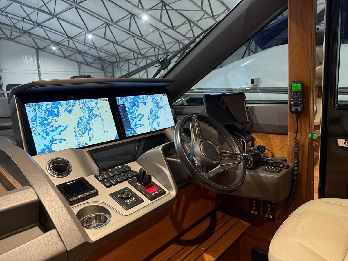 The helm station features advanced navigation systems and luxurious finishes. aboard PRINCESS 70 Yacht for Sale