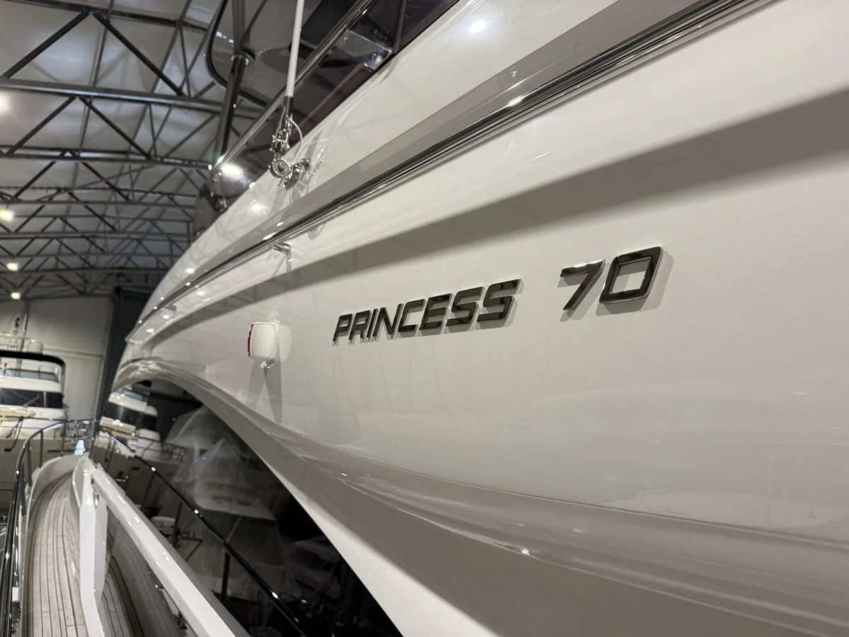 Close-up of the yacht's name and model number on its sleek exterior. aboard PRINCESS 70 Yacht for Sale