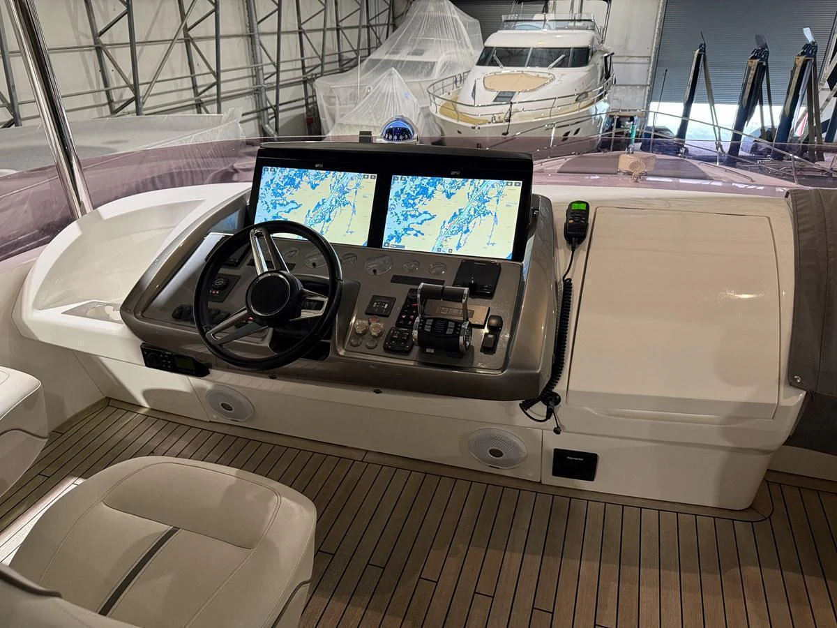 The helm station features advanced navigation systems and a sleek design. aboard PRINCESS 70 Yacht for Sale