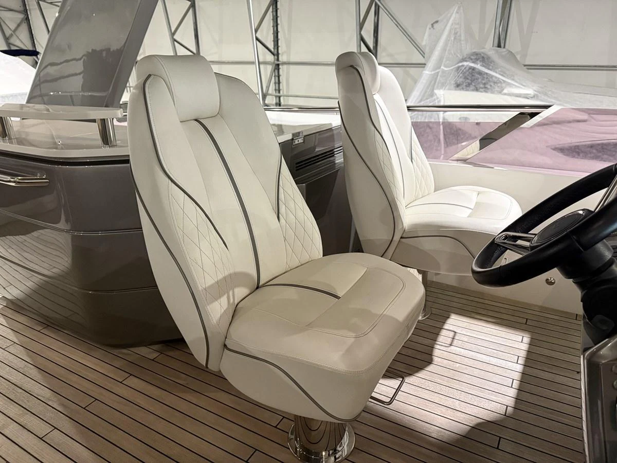 The helm area features luxurious, comfortable seating with a modern design. aboard PRINCESS 70 Yacht for Sale