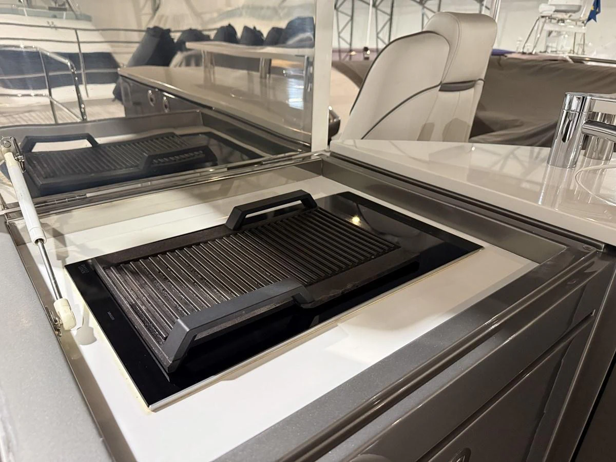 A sleek built-in grill is featured in the yacht's galley area. aboard PRINCESS 70 Yacht for Sale