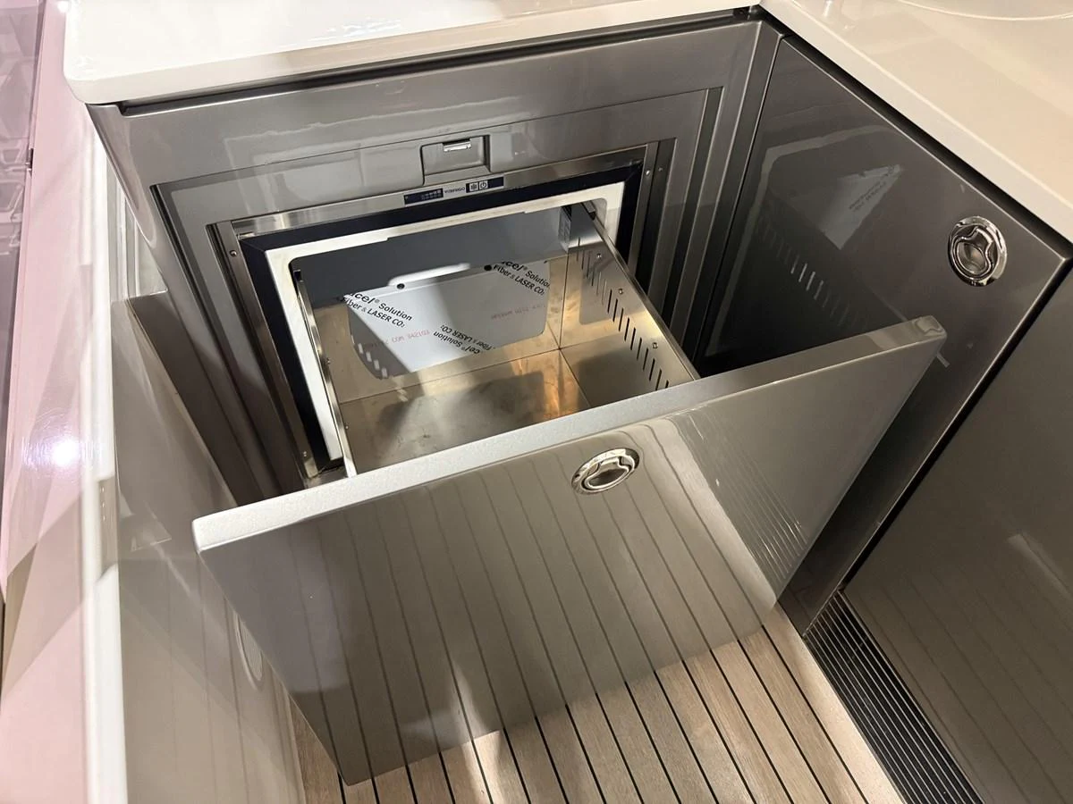 A sleek and modern galley detail featuring a built-in drawer refrigerator. aboard PRINCESS 70 Yacht for Sale