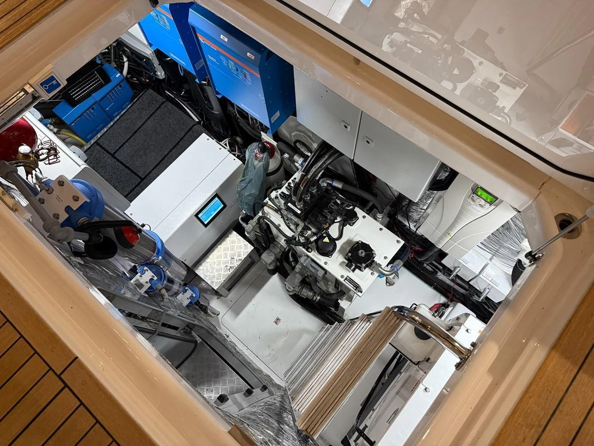The image showcases the well-organized and clean engine room of the yacht. aboard PRINCESS 70 Yacht for Sale
