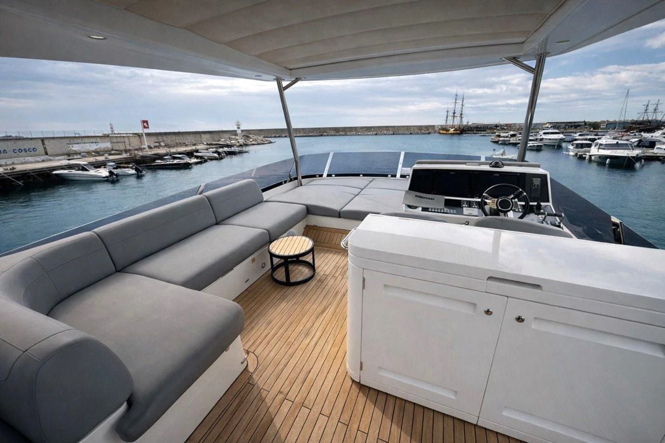 The flybridge offers a spacious seating area with a panoramic view of the marina. aboard SUNSEEKER 66 MANHATTAN Yacht for Sale