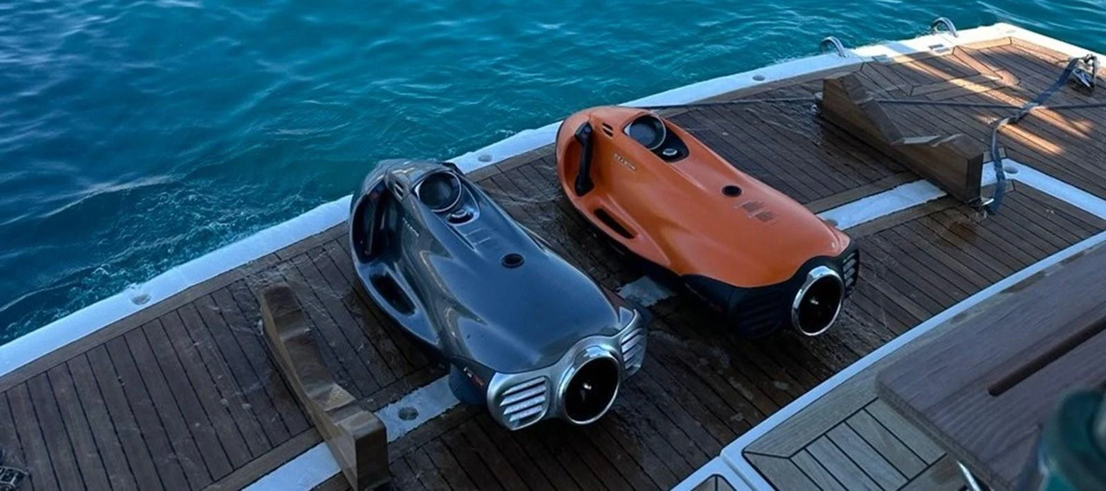 The image showcases two sleek underwater scooters on the yacht's deck, ready for aquatic adventures. aboard SUNSEEKER 66 MANHATTAN Yacht for Sale
