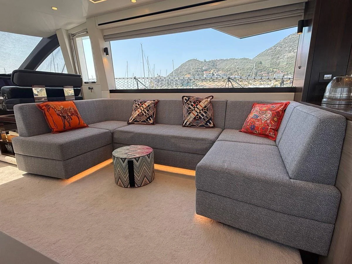 The salon features a spacious and stylish seating area with a modern design and vibrant accents. aboard SUNSEEKER 66 MANHATTAN Yacht for Sale