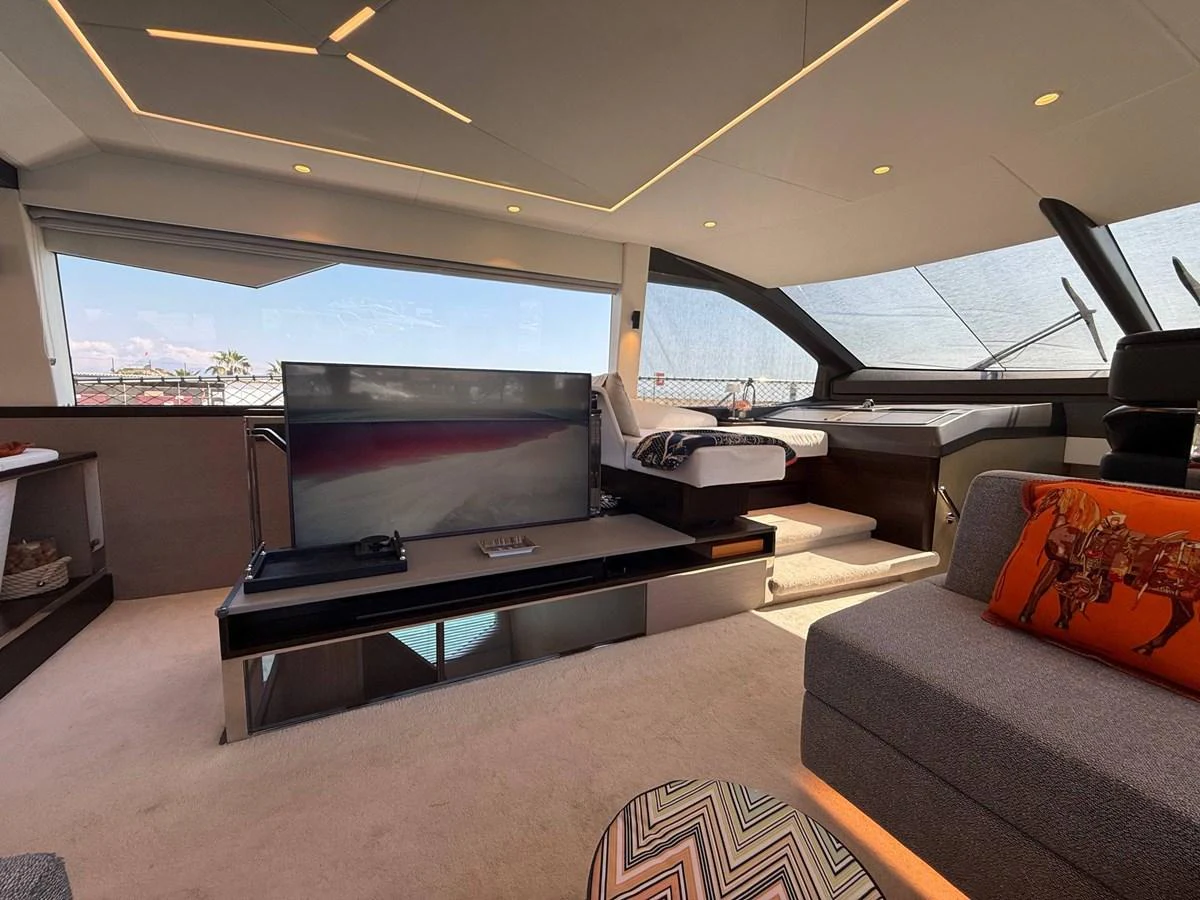 The salon offers a luxurious and comfortable space with modern furnishings and ample natural light. aboard SUNSEEKER 66 MANHATTAN Yacht for Sale