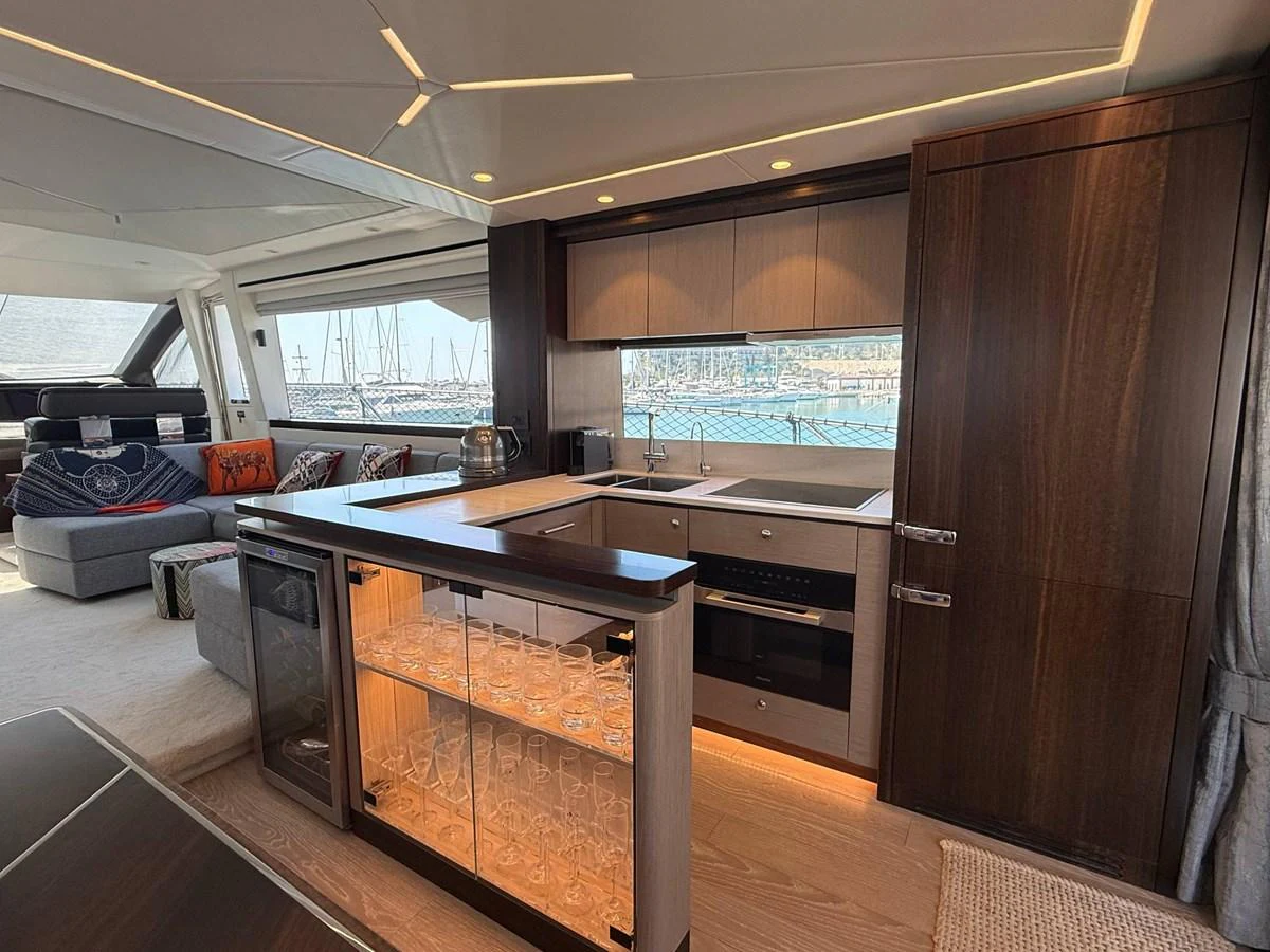 The yacht's galley features modern appliances and a stylish design, perfect for onboard culinary experiences. aboard SUNSEEKER 66 MANHATTAN Yacht for Sale