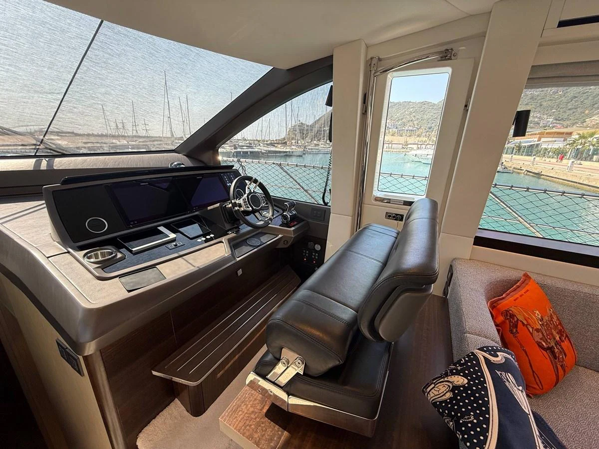 The helm station offers a sophisticated and comfortable command center with a panoramic view. aboard SUNSEEKER 66 MANHATTAN Yacht for Sale