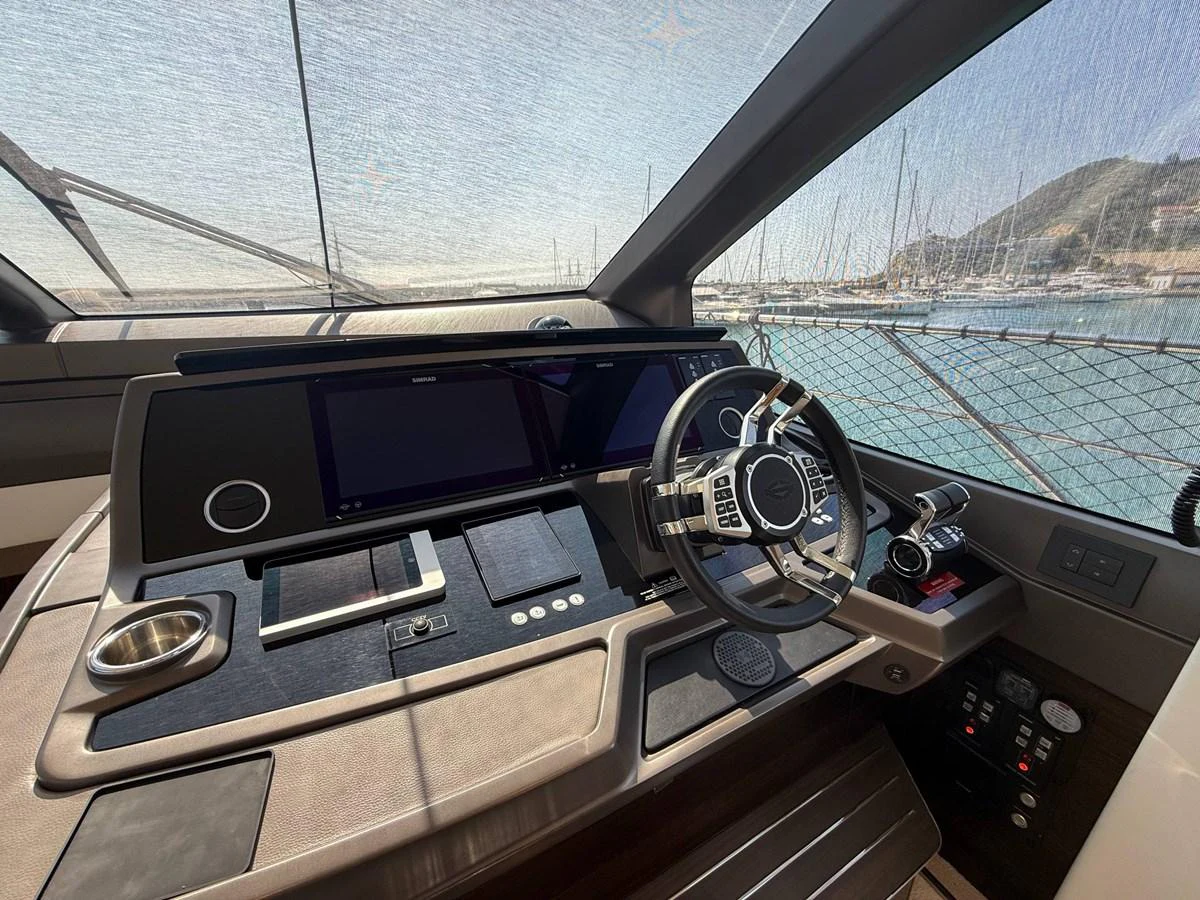 The helm station offers a sleek and modern design with advanced navigation equipment and a panoramic view. aboard SUNSEEKER 66 MANHATTAN Yacht for Sale