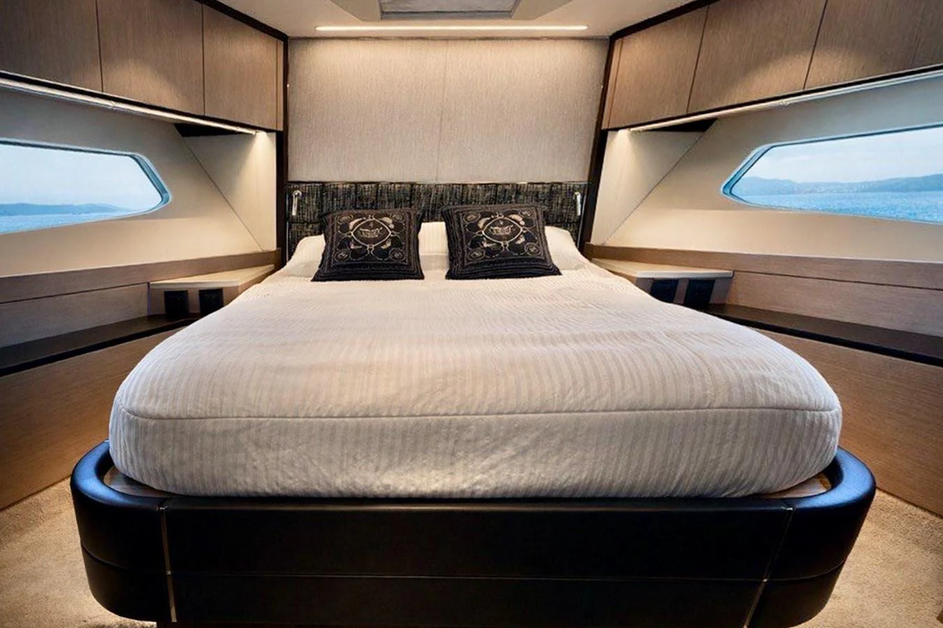 A luxurious stateroom featuring a large, comfortable bed with elegant bedding and ample natural light from the windows. aboard SUNSEEKER 66 MANHATTAN Yacht for Sale