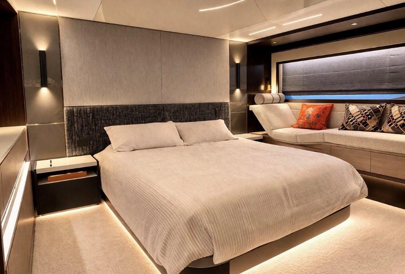 The master stateroom features a luxurious bed, ambient lighting, and elegant decor for ultimate comfort. aboard SUNSEEKER 66 MANHATTAN Yacht for Sale