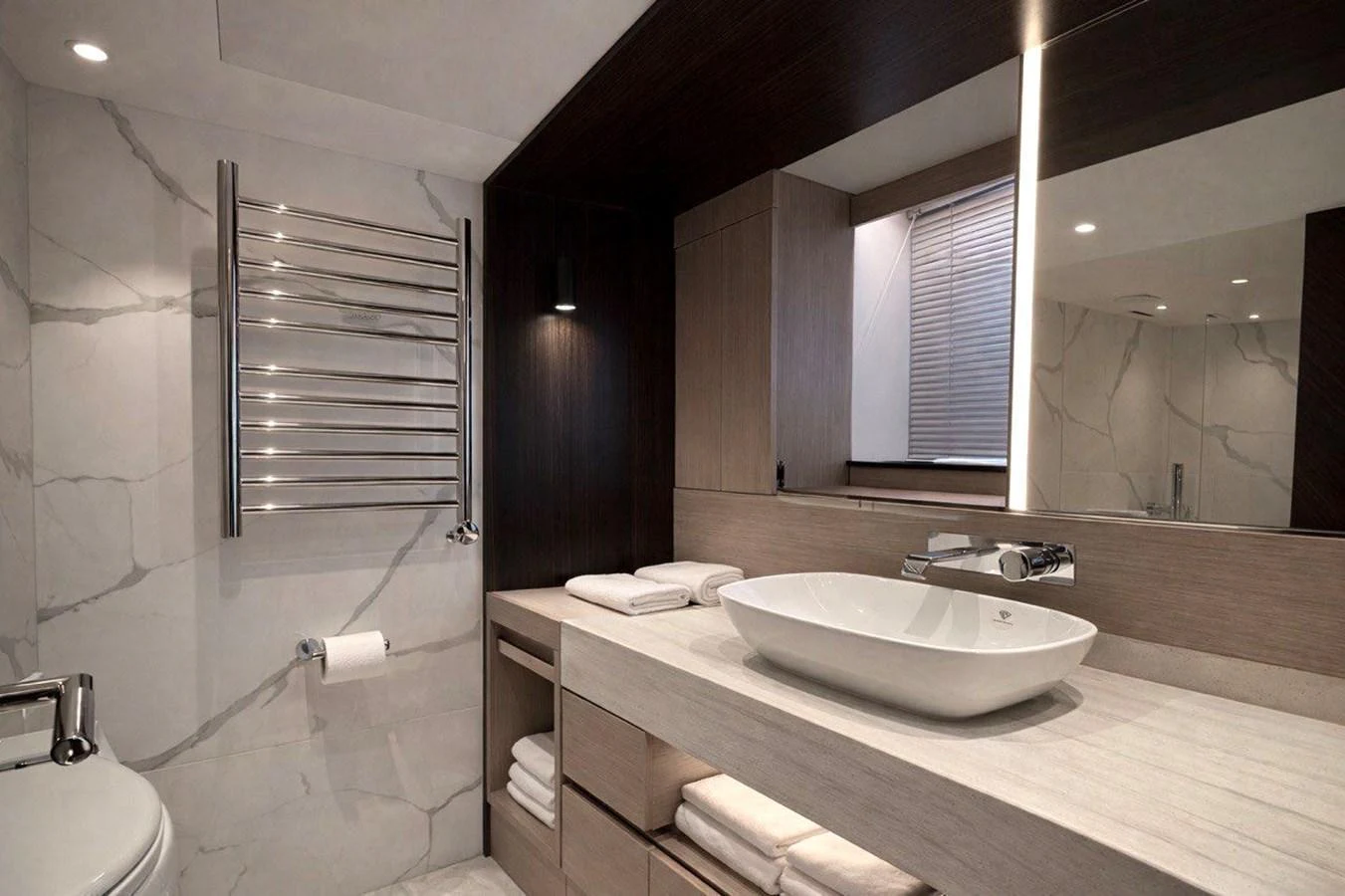 The yacht's bathroom features a sleek, modern design with luxurious finishes. aboard SUNSEEKER 66 MANHATTAN Yacht for Sale