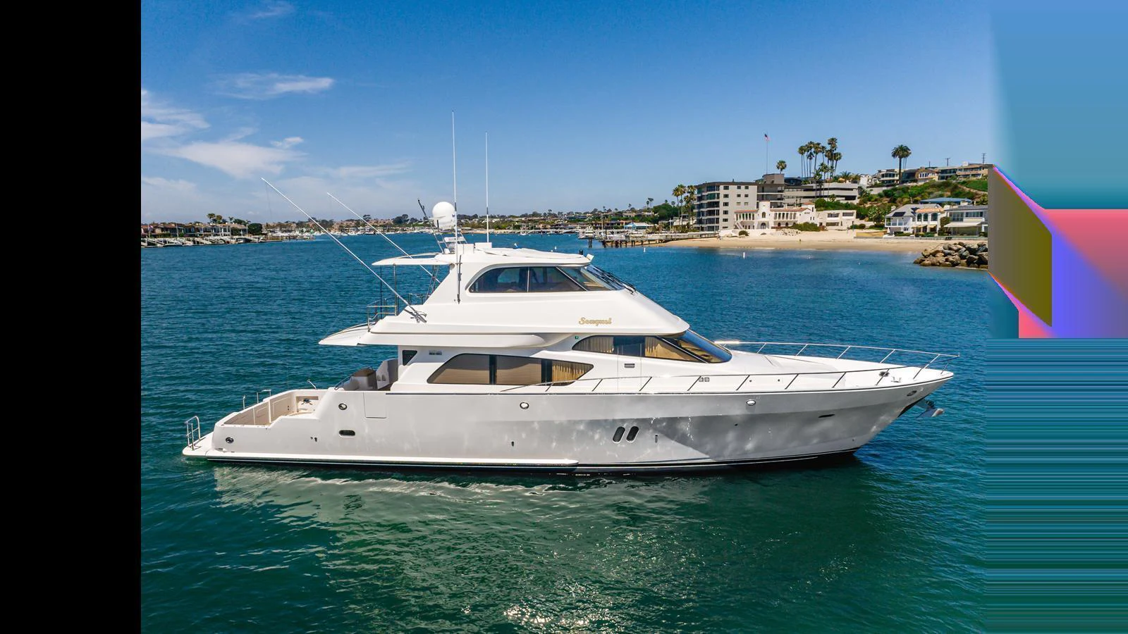 A sleek and modern yacht cruising on calm waters with a scenic coastal backdrop. aboard SEAQUEL Yacht for Sale