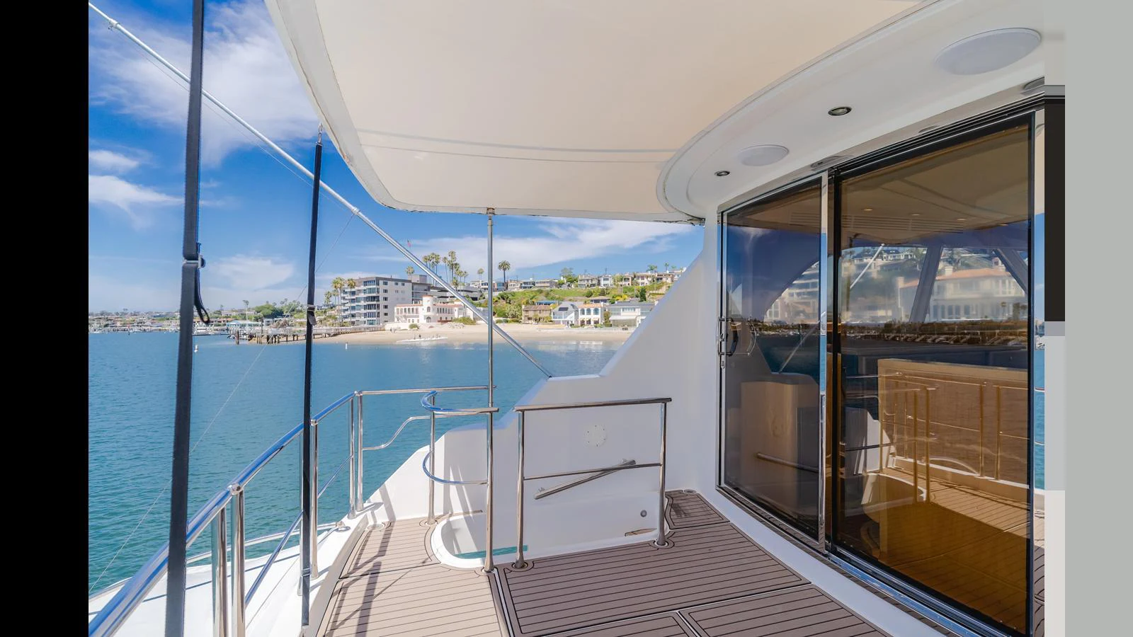 The aft deck offers a serene view of the water and shoreline, perfect for relaxation. aboard SEAQUEL Yacht for Sale