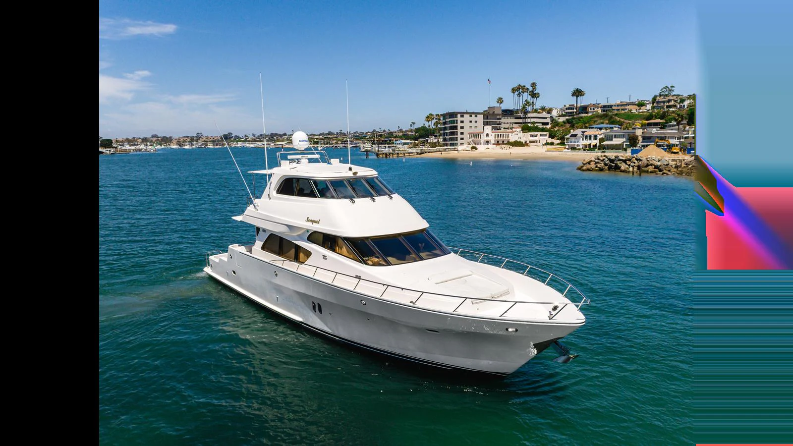 A sleek white yacht cruises gracefully on calm waters with a scenic coastal backdrop. aboard SEAQUEL Yacht for Sale