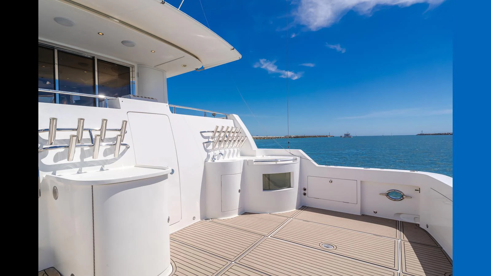 The aft deck offers a spacious and inviting area for relaxation and enjoyment with stunning ocean views. aboard SEAQUEL Yacht for Sale