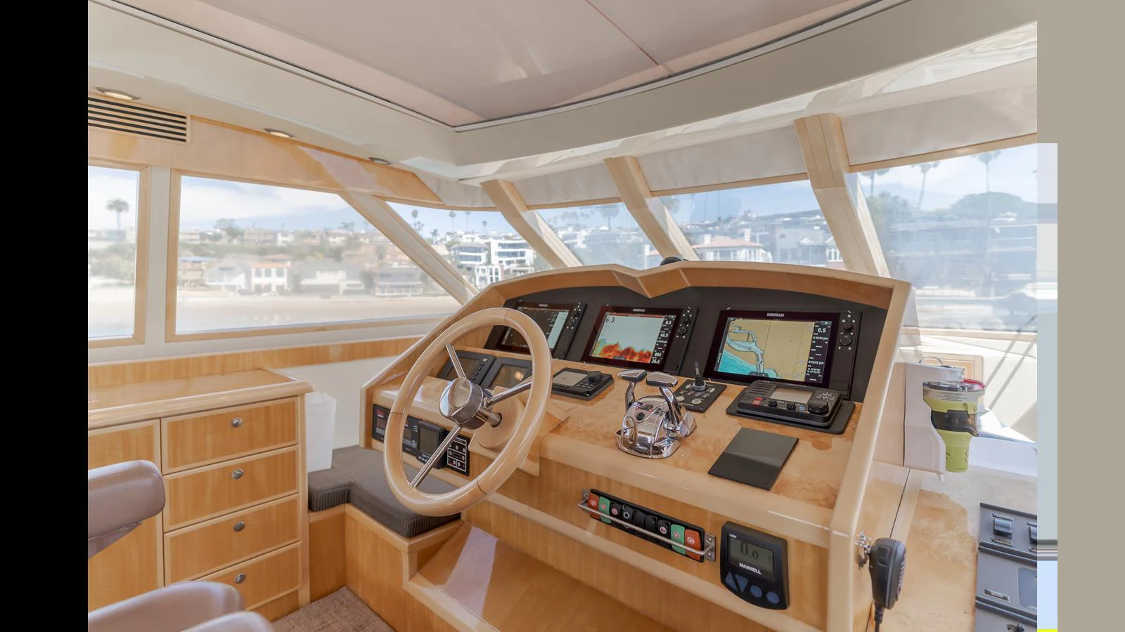 The helm station features advanced navigation equipment and a comfortable steering area with panoramic views. aboard SEAQUEL Yacht for Sale