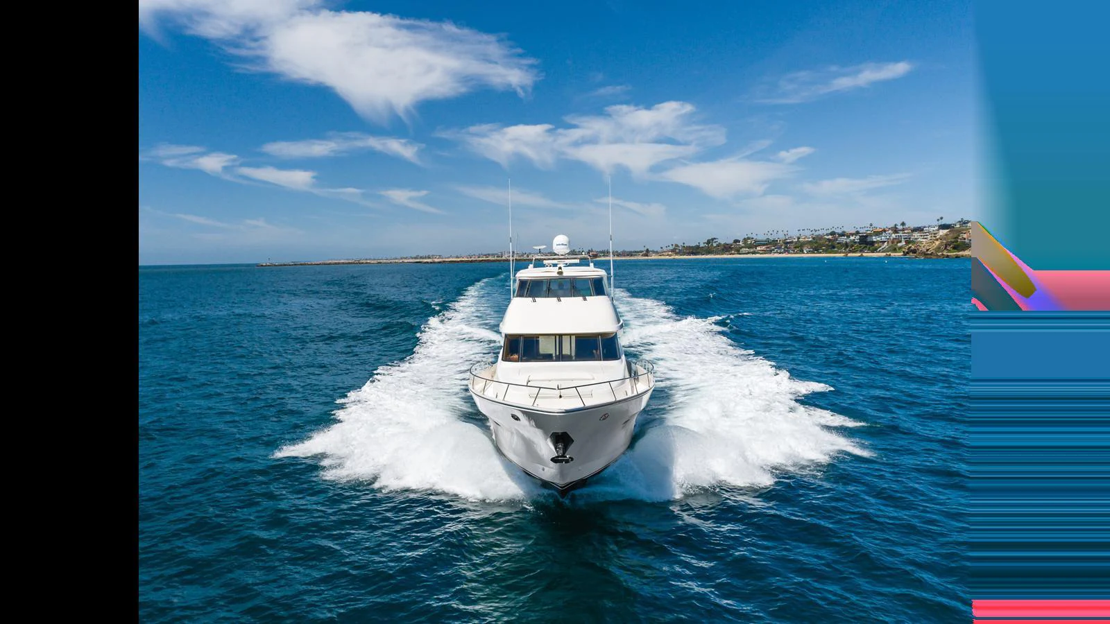 A sleek yacht cruises swiftly through the open water, leaving a trail of white foam behind. aboard SEAQUEL Yacht for Sale
