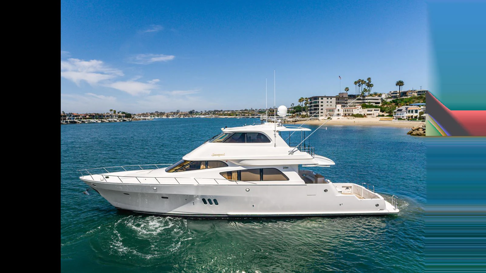 A sleek and elegant yacht glides through calm waters under a clear blue sky. aboard SEAQUEL Yacht for Sale