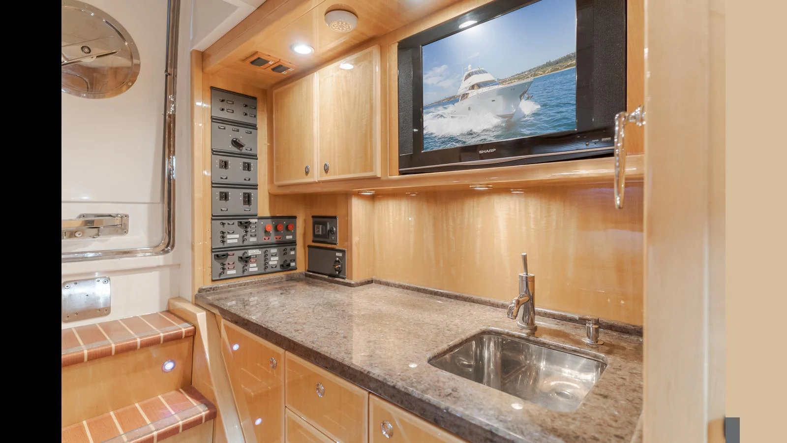 The galley features modern amenities with a sleek countertop and built-in appliances. aboard SEAQUEL Yacht for Sale