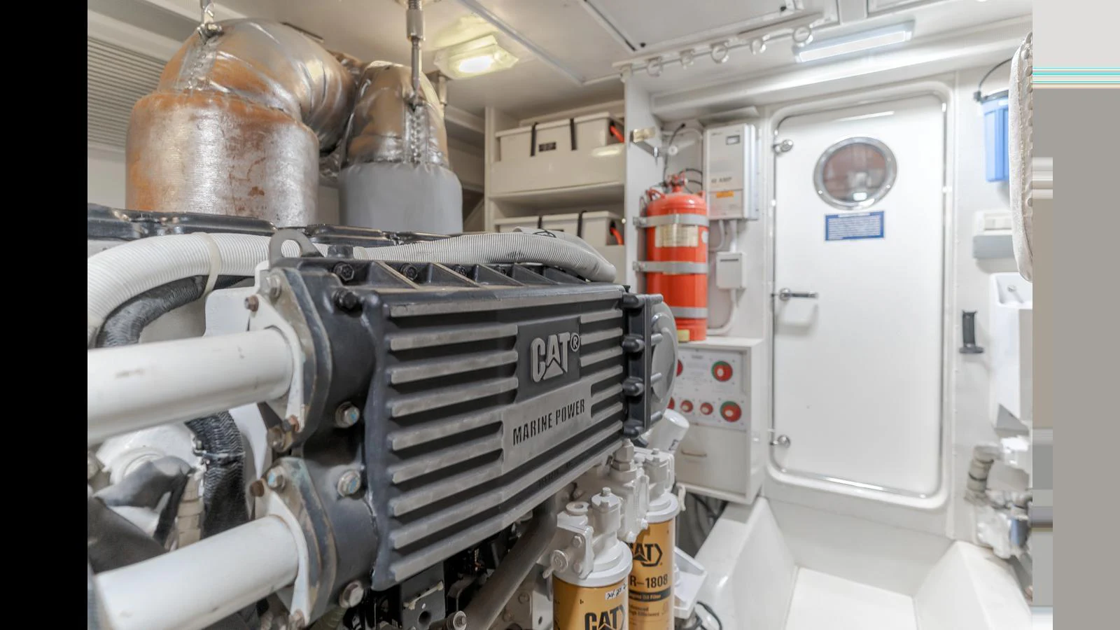 The image showcases the well-maintained engine room of the yacht, featuring high-quality machinery and safety equipment. aboard SEAQUEL Yacht for Sale